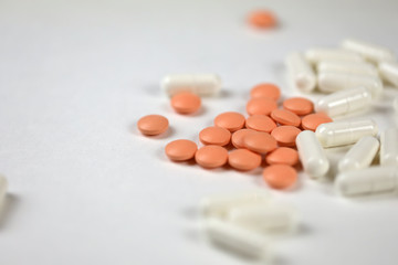pills, vitamins or dietary supplements on a white background