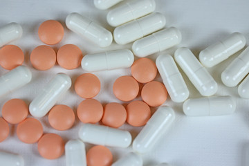 pills, vitamins or dietary supplements on a white background