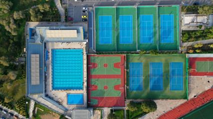 Aerial top down photo of tennis and basket ball court in exotic destination