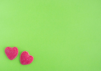 Pink hearts on light green background.  Valentine's day concept,  flat lay,  top view,  copy space 