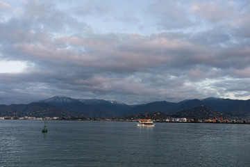 Panoramic view of the mountains and the sea in the city of Batumi. Georgia at sunset