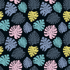 Exotic seamless colorful bright pattern with colorful tropical jungle leaves silhouettes on white background. Floral modern pattern for textile, manufacturing etc. Vector illustration