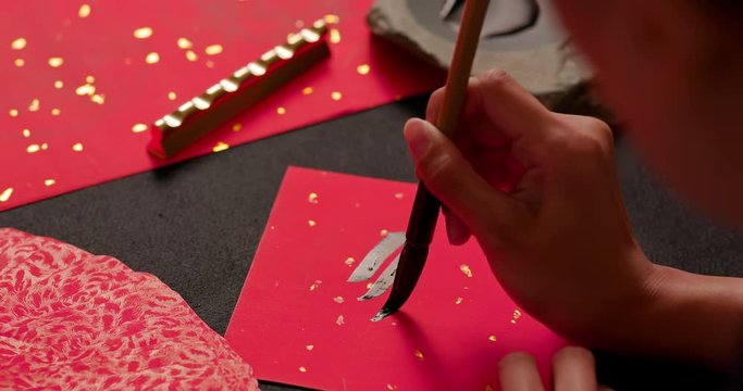 calligraphy with red spring couplet