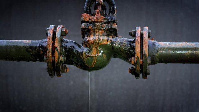 Water leaking from old rusty water supply pipe