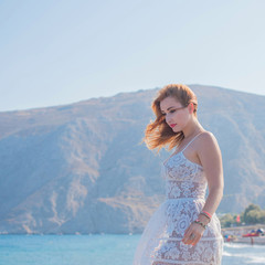 Fototapeta na wymiar Nice plus size European or American woman rest in Santorini, vacation in Greece