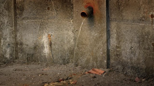 Water leaking from old rusty water supply pipe
