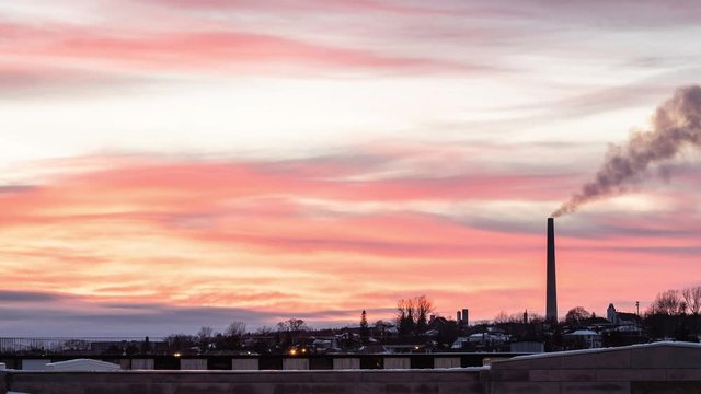 Timelapse of superstack mining chimney in Sudbury during a winter sunset