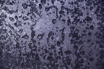 Frozen drops of water on glass, background