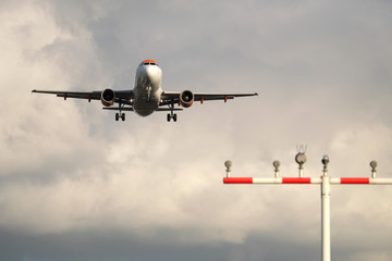 Aircraft warning lights and airplane before landing - Stockphoto