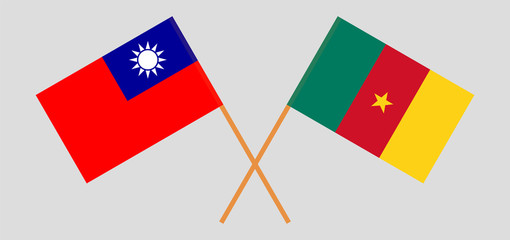 Crossed and waving flags of Cameroon and Taiwan