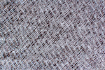 Gray fabric texture with diagonal stitches of lines.