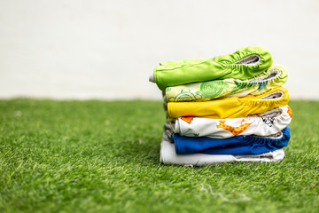 Stack of colorful cloth diapers for baby