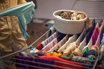 Washing clothes at home. Mom erases things.