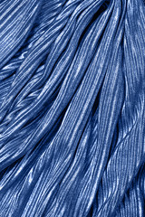 Classic Blue metallic colored fabric texture. Concept of color of 2020