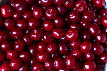 Close up of pile of ripe cherries without stalks and leaves. Ripe cherries background