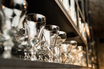 Wine and beer glass shelves in a restaurant or pub