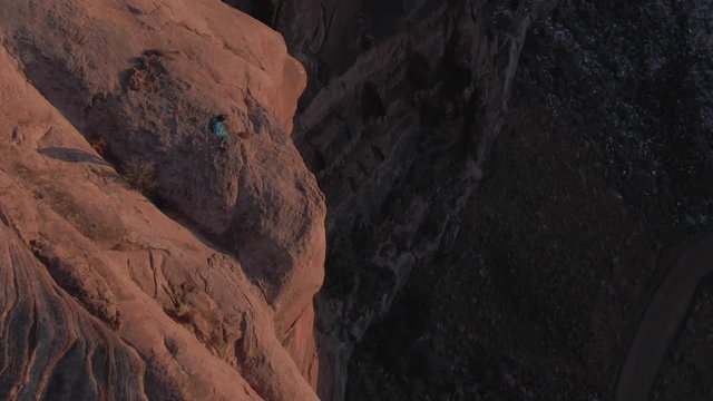 BASE jump at sunset - 4k aerial slow orbit and track