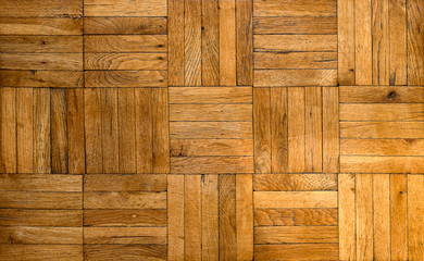 Fragment of old wooden parquet floor. Tileable background of an inlaid mosaique type parquet   floor.