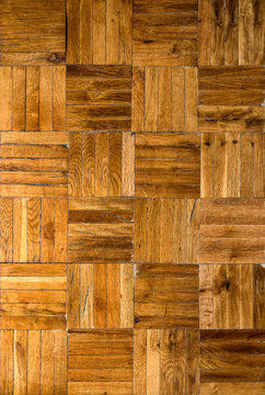 Fragment of old wooden parquet floor. Tileable background of an inlaid mosaique type parquet   floor.
