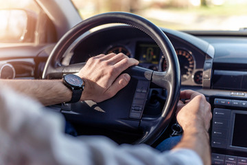 Man driving car.