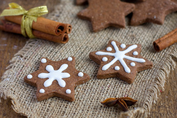 Fototapeta na wymiar Star shape Christmas chocolate gingerbread Cookie on sacking