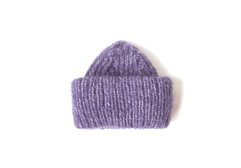 Knitted hat on the white background. Copy space. Place for text.  Isolated object. Best present on the Chritmas.