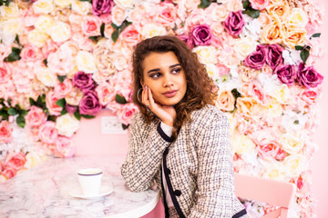 Beautiful young woman using laptop at cafe