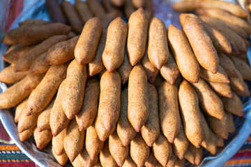 a kind of meatball made with bulgur. a dish made in various regions in Turkey