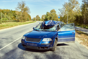 Crossover collision with a bus stop on a road at the scene of a car accident