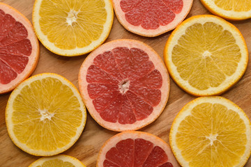 Fototapeta na wymiar Background of fresh citruses, oranges and grapefruit.