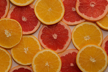 Background of fresh citruses, oranges and grapefruit.