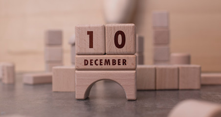December 10 written with wooden blocks