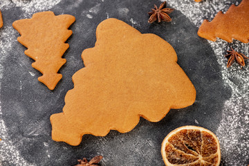 various gingerbread christmas trees on dark table