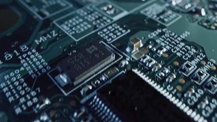Macro Camera Moving Slowly over Printed Circuit Board, showing Computer Motherboard Components: Microchip, CPU Processor, Transistors. Inside of Electronic Device. Picture Becoming More Illuminated
- Powered by Adobe