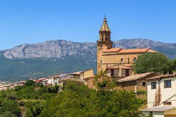 Fototapeta na wymiar Elvillar, Spain. The picturesque landscape with church on a background of mountains