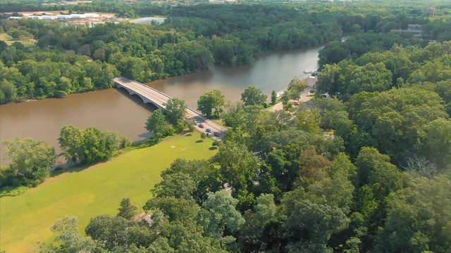 Aerial flying over bridge and traffic on Carnegie Lake. Situated next  Princeton University. New Jersey, USA