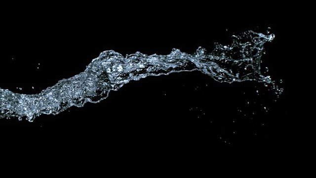 Super Slow Motion Shot of Water Splash on Black Background at 1000fps. Shooted with High Speed Cinema Camera at 4K