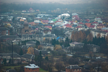 Houses in a city hazy in the autumn