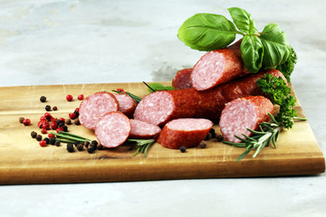 sausage slices, smoked meat product (tasty snack salami) menu concept. food background with cracow sausages