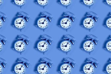 Pattern of alarm clock on blue.