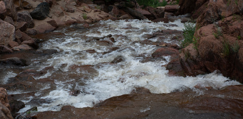 Mountain stream rushing over rocks in Colorado