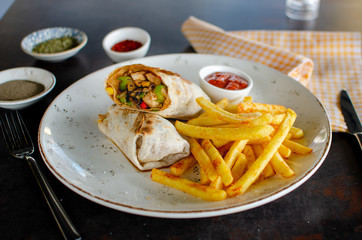 Wrap sandwiches with fries stock photo.