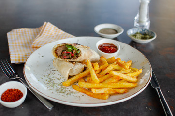 Wrap sandwiches with fries stock photo.