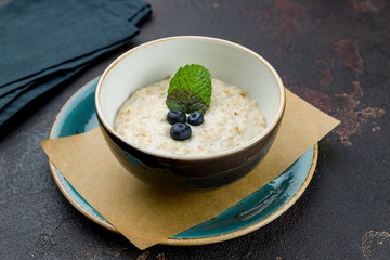 Oatmeal porridge with blueberries and mint