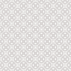 Subtle vector geometric seamless pattern with small rounded shapes, squares and circles. Simple modern abstract background. Funky texture in neutral colors, white and gray. Minimal repeat design 