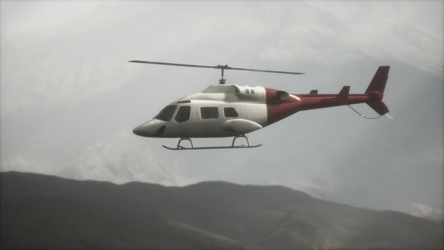 extreme slow motion flying helicopter near mountains with fog