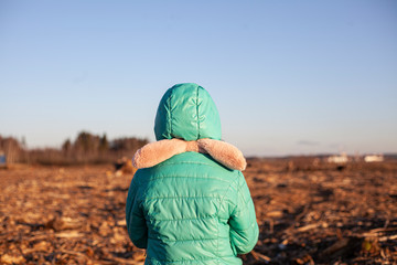A child at a clearing. Environmental protection by children.