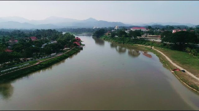 Aerial 4k footage of Sungai Perak and a bridge accross it in one of the city in Northern Malaysia, Kuala Kangsar in Perak, Malaysia. 