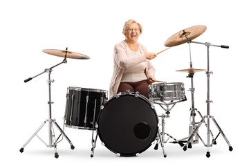 Elderly woman playing drums