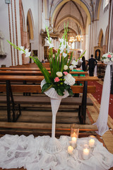 Church sanctuary before a wedding ceremony. Empty chairs for bride and groom.